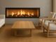 Are Inbuilt Wood Fireplaces Environmentally Friendly? Modern inbuilt wood fireplace with a sealed firebox and matched flue kit, bright clean flames visible through clear glass.