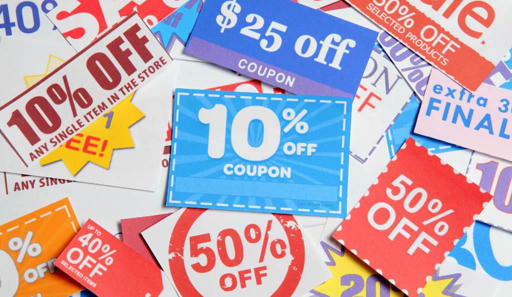 Collection of colorful discount coupons displaying various offers, including 10% off, 50% off, $25 off, and other promotional deals printed