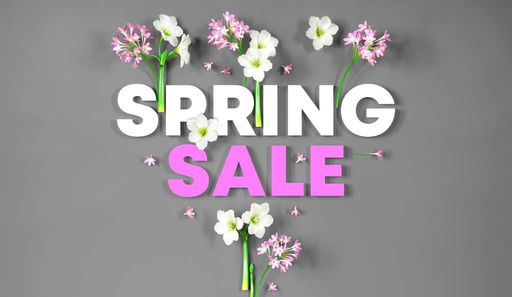 Spring sale promotional banner with bold white and pink text surrounded by delicate pink and white flowers on a gray background season