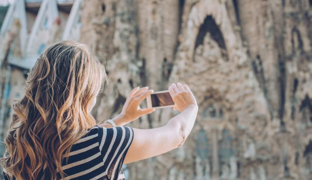 Tourist capturing a breathtaking mountain view girl mountain mobile